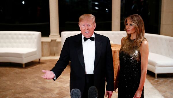 U.S. President Donald Trump accompanied by first lady Melania Trump, speaks to the press at the Mar-a-Lago resort in Palm Beach, Florida, U.S. December 31, 2019.    - Sputnik International