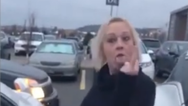 Patricia Zammit, a 51-year-old resident of Hamilton, Ontario, was arrested and charged on December 30 with uttering threats and assault after Canadian police launched an investigation into a parking lot dispute in which Zammit yelled a racial slur. - Sputnik International