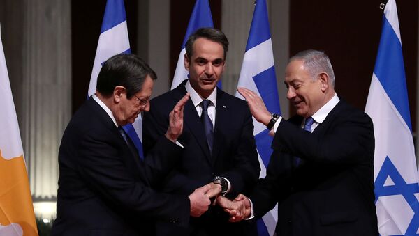 Cypriot President Nicos Anastasiades, Greek Prime Minister Kyriakos Mitsotakis and Israeli Prime Minister Benjamin Netanyahu pose for a photo before signing a deal to build the EastMed subsea pipeline to carry natural gas from the eastern Mediterranean to Europe, at the Zappeion Hall in Athens, Greece, January 2, 2020. - Sputnik International