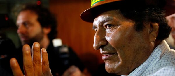 Former Bolivian President Evo Morales waves to supporters after a news conference following a meeting with members of the Movimiento al Socialismo (MAS) party to fix the date and place where the Bolivian presidential candidate for the MAS party will be chosen, in Buenos Aires, Argentina December 29, 2019. - Sputnik International