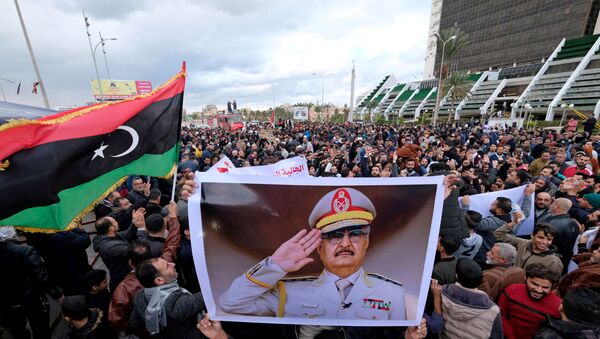 Libyan protesters gather during a demonstration against the Turkish parliament's decision to send Turkish forces to Libya, in Benghazi, Libya January 3, 2020.  - Sputnik International