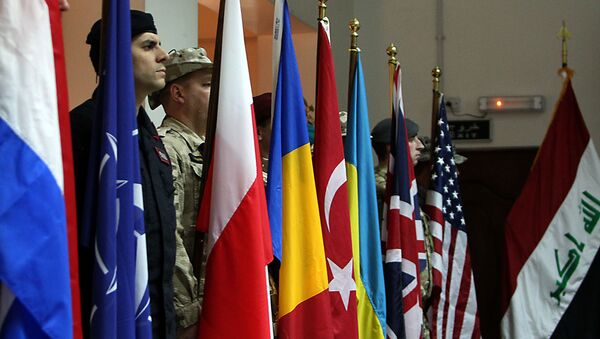 NATO soldiers stand to attention during a ceremony in the Iraqi capital Baghdad - Sputnik International