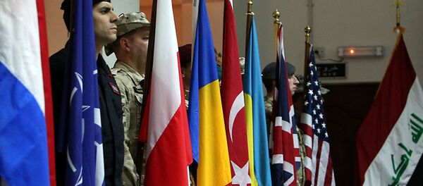 NATO soldiers stand to attention during a ceremony in the Iraqi capital Baghdad - Sputnik International