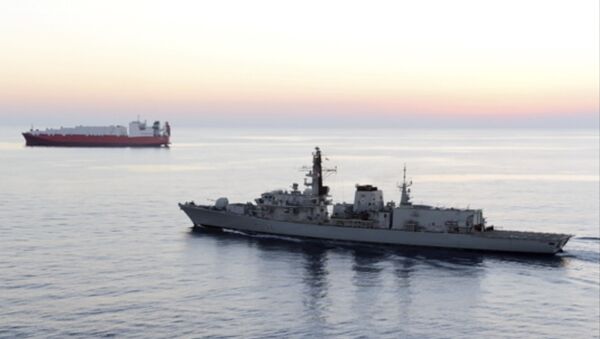 British navy vessel HMS Montrose escorts another ship - Sputnik International