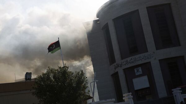 FILE - In this Dec. 25, 2018, file, photo, smoke rises shortly after an attack on the foreign ministry building, in Tripoli - Sputnik International