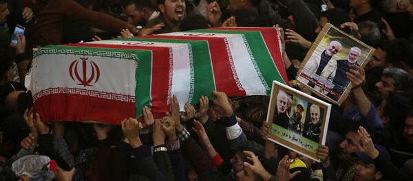 Mourners attend the funeral procession of the Iranian Major-General Qassem Soleimani, head of the elite Quds Force of the Revolutionary Guards, and the Iraqi militia commander Abu Mahdi al-Muhandis, who were killed in an air strike at Baghdad airport, in Kerbala, Iraq, January 4, 2020.  - Sputnik International