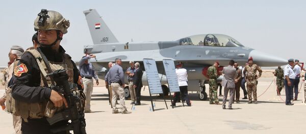 raqi SWAT team stands guard as security forces and others gather next to a U.S.- made F-16 fighter jet during the delivery ceremony at Balad air base raqi SWAT team stands guard as security forces and others gather next to a U.S.- made F-16 fighter jet during the delivery ceremony at Balad air base - Sputnik International