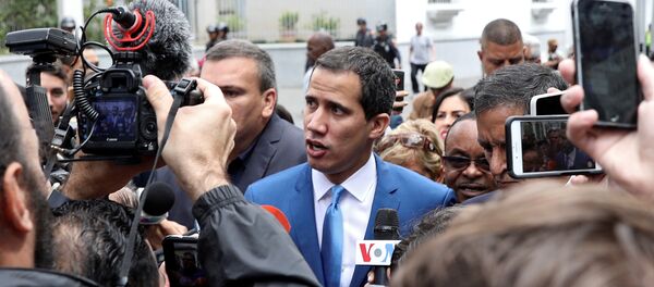 Venezuelan opposition leader Juan Guaido, who many nations have recognised as the country's rightful interim ruler, speaks to reporters outside Venezuela's National Assembly building in Caracas in Caracas, Venezuela January 5, 2020. - Sputnik International