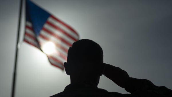 This US Air Force file photo obtained January 5, 2020 shows US Air Force Staff Sgt. Devin Boyer, 435th Air Expeditionary Wing photojournalist, as he salutes the flag at Camp Simba, Kenya, on August 26, 2019. - Sputnik International
