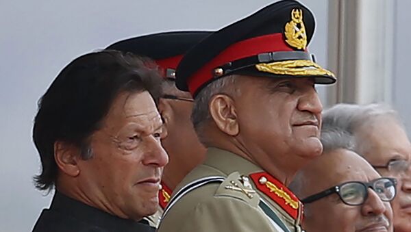 In this March 23, 2019 photo, Pakistan's Army Chief Gen. Qamar Javed Bajwa, center, watches a parade with Prime Minister Imran Khan, left, and President Arif Alvi, in Islamabad, Pakistan.  - Sputnik International