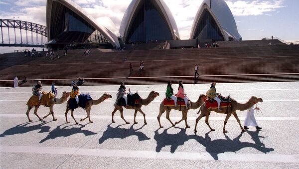Camels and their jockeys parade in front of the Sydney Opera House 20 August promoting what will be the first major camel race meet to be held in Australia. - Sputnik International