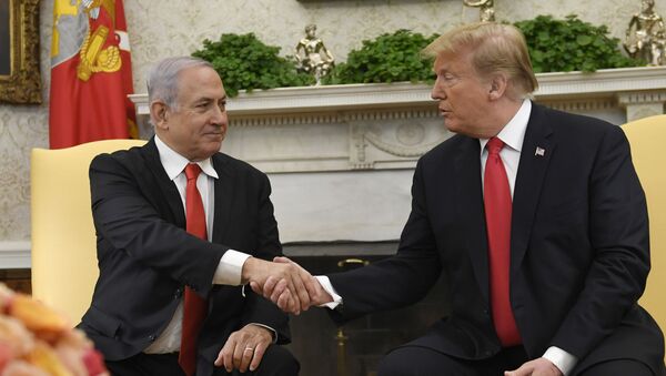 President Donald Trump, right, and Israeli Prime Minister Benjamin Netanyahu, left, shake hands in the Oval Office of the White House in Washington, Monday, March 25, 2019, at the beginning of their meeting.  - Sputnik International