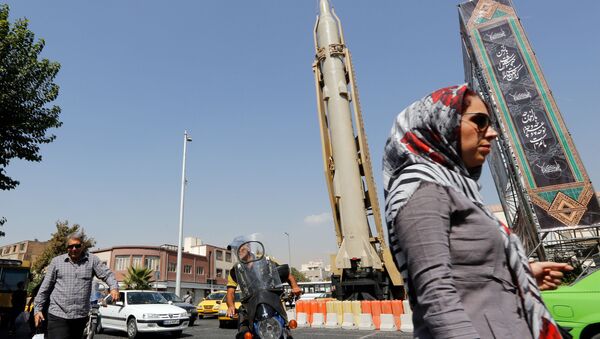 A Shahab-3 surface-to-surface missile is pictured on display in a street exhibition by Iran's army and paramilitary Revolutionary Guard celebrating  Defence Week marking the 39th anniversary of the start of 1980-88 Iran-Iraq war, at the Baharestan Square in Tehran, on September 26 2019 - Sputnik International