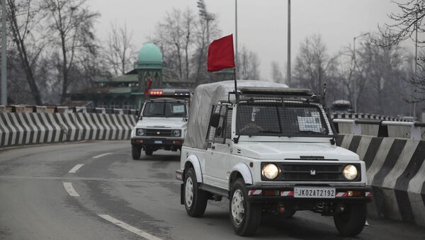 Security vehicles of Indian police guard a convoy of New Delhi-based diplomats passing through Srinagar, Indian controlled Kashmir, Thursday, Jan. 9, 2020 - Sputnik International