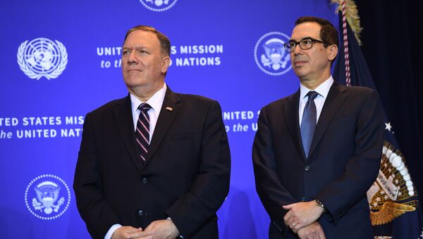 US Secretary of State Mike Pompeo and Secretary of the Treasury Steven Mnuchin listen as President Donald Trump speaks at a press conference in New York, September 25, 2019, on the sidelines of the United Nations General Assembly. - Sputnik International