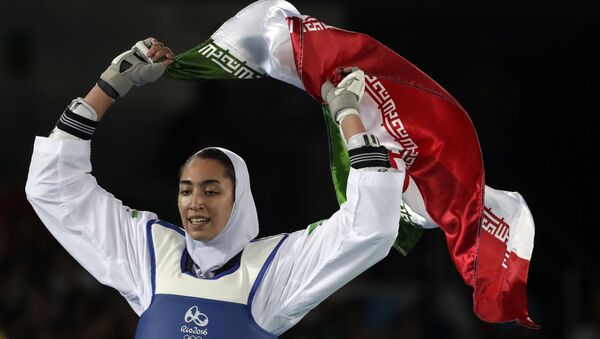 Kimia Alizadeh Zenoorin of Iran celebrates after winning the bronze medal in a women's Taekwondo 57-kgcompetition at the 2016 Summer Olympics in Rio de Janeiro, Brazil, Thursday, Aug. 18, 2016. (AP Photo/Andrew Medichini) - Sputnik International