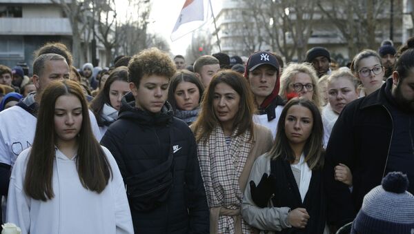 Doria Chouviat (C) and her relatives attend on January 12, 2020 a rally in the streets of Levallois for her late husband, Cedric Chouviat, a delivery driver who died after being held on the ground during a tense police check on January 3. - Sputnik International