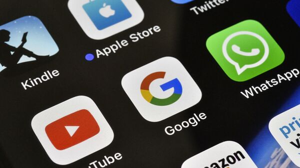 The icons of Google, WhatsApp and YouTube are pictured on an iPhone on Thursday, Nov. 15, 2018 in Gelsenkirchen, Germany - Sputnik International