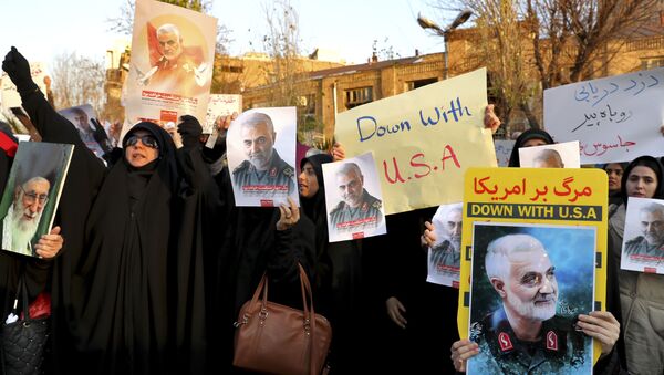 Protesters chant slogans and hold up posters of Gen. Qassem Soleimani during a demonstration in front of the British Embassy in Tehran, Iran, Sunday, Jan. 12, 2020 - Sputnik International