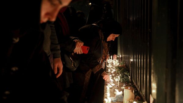 People gather for a candlelight vigil to remember the victims of the Ukraine plane crash, at the gate of Amri Kabir University that some of the victims of the crash were former students of, in Tehran, Iran, Saturday, Jan. 11, 2020. Iran on Saturday, Jan. 11, acknowledged that its armed forces unintentionally shot down the Ukrainian jetliner that crashed earlier this week, killing all 176 aboard, after the government had repeatedly denied Western accusations that it was responsible. - Sputnik International