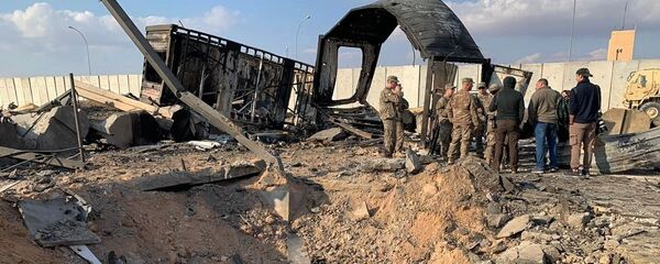 U.S. Soldiers and journalists stand near a crater caused by Iranian bombing at Ain al-Asad air base, in Anbar, Iraq, Monday, Jan. 13, 2020 U.S. Soldiers and journalists stand near a crater caused by Iranian bombing at Ain al-Asad air base, in Anbar, Iraq, Monday, Jan. 13, 2020 - Sputnik International