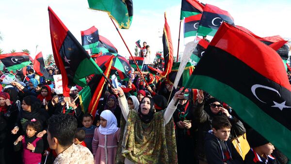 Libyans celebrate in Tripoli's landamark Martyrs square on February 17, 2015 the upcoming fourth anniversary of the Libyan revolution - Sputnik International