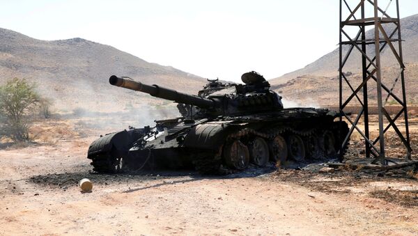 A destroyed and burnt tank that belonged to the eastern forces led by Khalifa Haftar, is seen in Gharyan south of Tripoli - Sputnik International