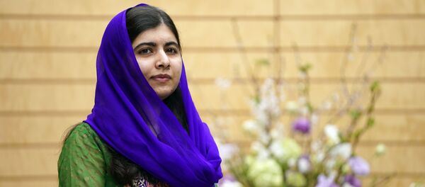 Nobel Peace Prize laureate Malala Yousafzai looks on before her meeting with Japanese Prime Minister Shinzo Abe at Abe's official residence in Tokyo, Friday, March 22, 2019 Nobel Peace Prize laureate Malala Yousafzai looks on before her meeting with Japanese Prime Minister Shinzo Abe at Abe's official residence in Tokyo, Friday, March 22, 2019 - Sputnik International