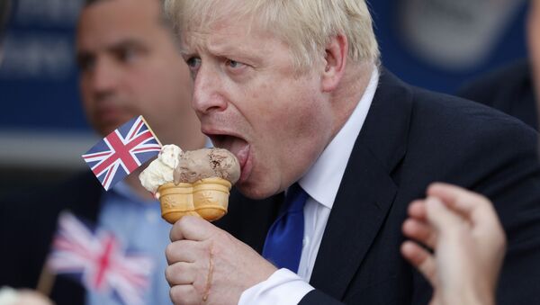 Conservative Party leadership candidate Boris Johnson eats an ice cream in Barry Island, Wales, Saturday, July 6, 2019 ahead of the Conservative party leadership hustings in Cardiff - Sputnik International
