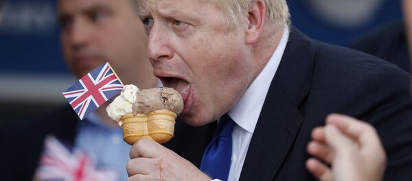 Conservative Party leadership candidate Boris Johnson eats an ice cream in Barry Island, Wales, Saturday, July 6, 2019 ahead of the Conservative party leadership hustings in Cardiff - Sputnik International