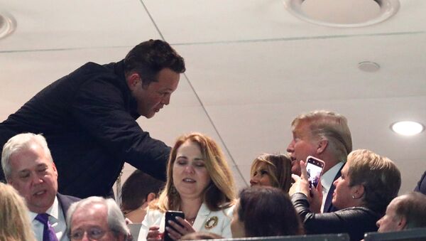 Jan 13, 2020; New Orleans, Louisiana, USA; Movie actor Vince Vaughn greets First Lady Melania Trump and President Donald J. Trump in the College Football Playoff national championship game between the Clemson Tigers and the LSU Tigers at Mercedes-Benz Superdome.  - Sputnik International