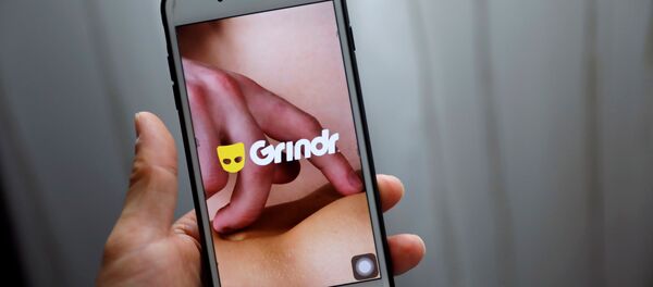 Grindr app is seen on a mobile phone in this photo illustration taken in Shanghai, China March 28, 2019. Grindr app is seen on a mobile phone in this photo illustration taken in Shanghai, China March 28, 2019. - Sputnik International