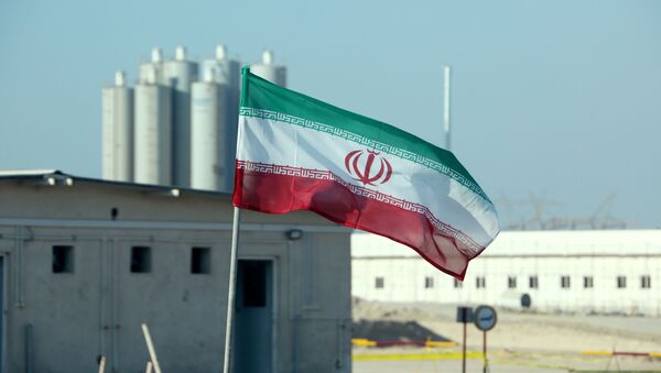 (FILES) In this file photo taken on November 10, 2019 an Iranian flag flutters in Iran's Bushehr nuclear power plant, during an official ceremony to kick-start works on a second reactor at the facility - Sputnik International
