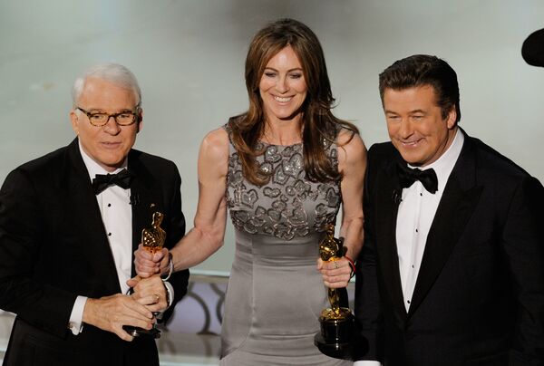 Director Kathryn Bigelow (C), winner of Best Director award for The Hurt Locker, with co-hosts Steve Martin and Alec Baldwin, onstage during the 82nd Annual Academy Awards held at Kodak Theatre on March 7, 2010 in Hollywood, California.  - Sputnik International