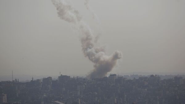 Smoke rises after an Israeli forces strike in Gaza City - Sputnik International