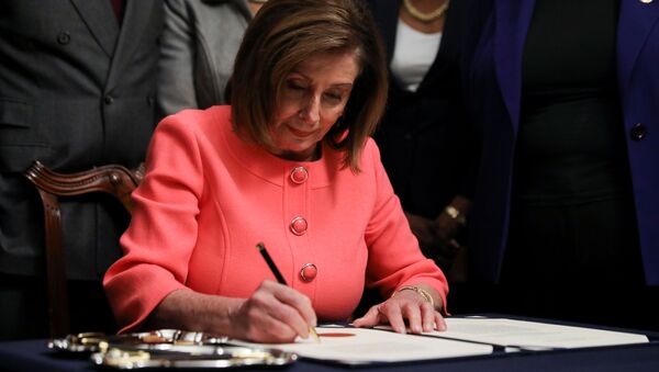 U.S. House Speaker Nancy Pelosi (D-CA) signs the two articles of impeachment of U.S. President Donald Trump before sending them over to the U.S. Senate during an engrossment ceremony at the U.S. Capitol in Washington, U.S., January 15, 2020 - Sputnik International