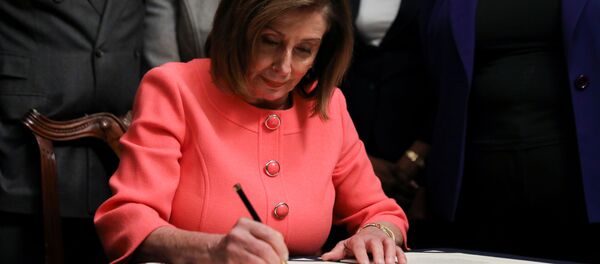 U.S. House Speaker Nancy Pelosi (D-CA) signs the two articles of impeachment of U.S. President Donald Trump before sending them over to the U.S. Senate during an engrossment ceremony at the U.S. Capitol in Washington, U.S., January 15, 2020 - Sputnik International