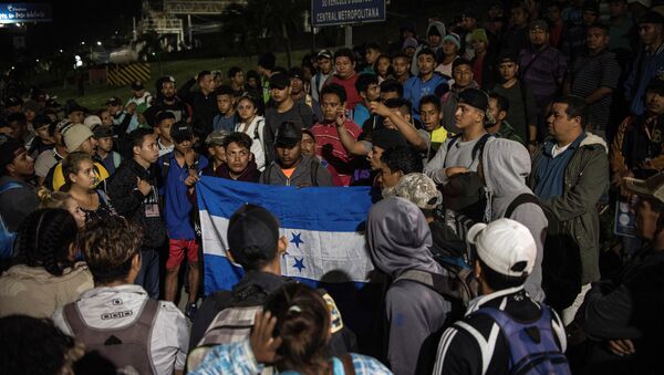 Hondurans gather to depart in a new caravan of migrants, set to head to the United States, in San Pedro Sula, Honduras January 15, 2020.  - Sputnik International