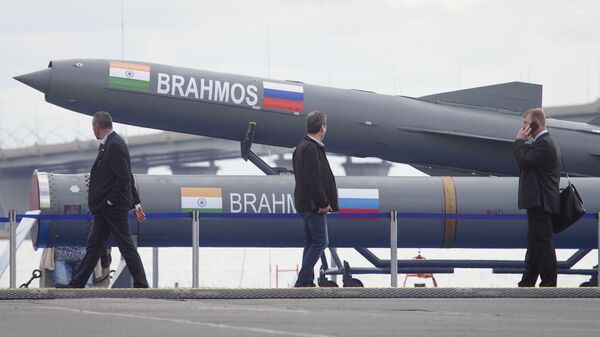Visitors walk past an Indian Brahmos anti-ship missile at the International Maritime Defence show in St.Petersburg, Russia, Thursday, July 11, 2019 - Sputnik International