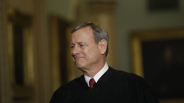 Chief Justice of the United States, John Roberts walks to the Senate chamber at the Capitol in Washington, Thursday, Jan. 16, 2020 - Sputnik International