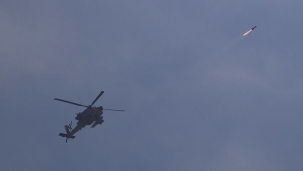 Israeli attack helicopter fires a missile into Gaza - Sputnik International
