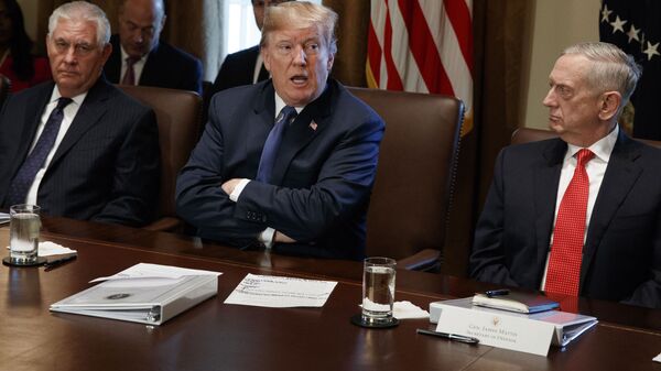 Secretary of State Rex Tillerson, left, and Secretary of Defense Jim Mattis, right, listen as President Donald Trump - Sputnik International