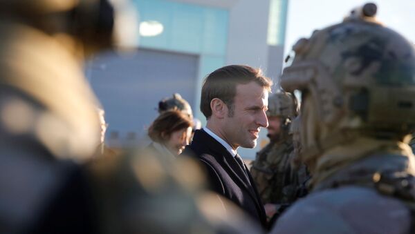 French President Emmanuel Macron talks to soldiers as he visits the 123 Air Base of Orleans-Bricy to give his New Year speech to France's armed forces, in Boulay-les-Barres near Orleans, France January 16, 2020. - Sputnik International