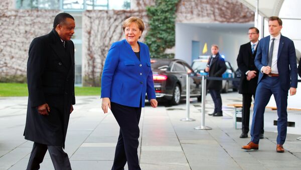 German Chancellor Angela Merkel welcomes Republic of the Congo's President Denis Sassou Nguesso at the beginning of the Libya summit in Berlin, Germany, January 19, 2020.  REUTERS/Hannibal Hanschke - Sputnik International