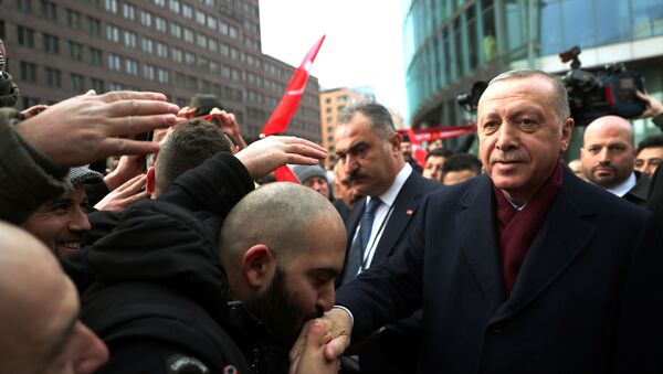 Turkish President Tayyip Erdogan is greeted by his supporters as he arrives for the Libya summit in Berlin, Germany, January 19, 2020.  - Sputnik International
