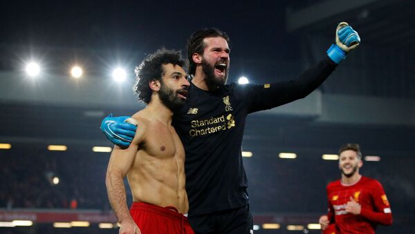 Liverpool's Mohamed Salah celebrates scoring their second goal with Alisson - January 19, 2020 - Sputnik International