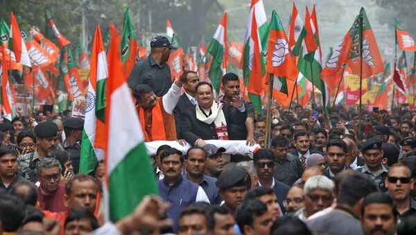 Jagat Prakash Nadda, Working President of India's ruling Bharatiya Janata Party (BJP), waves as he attends a march in support of a new citizenship law, in Kolkata, India, 23 December 2019 - Sputnik International