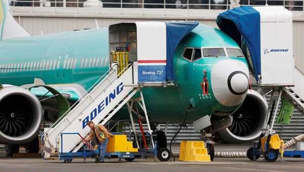 An employee works near a Boeing 737 Max aircraft at Boeing's 737 Max production facility in Renton, Washington, U.S - Sputnik International