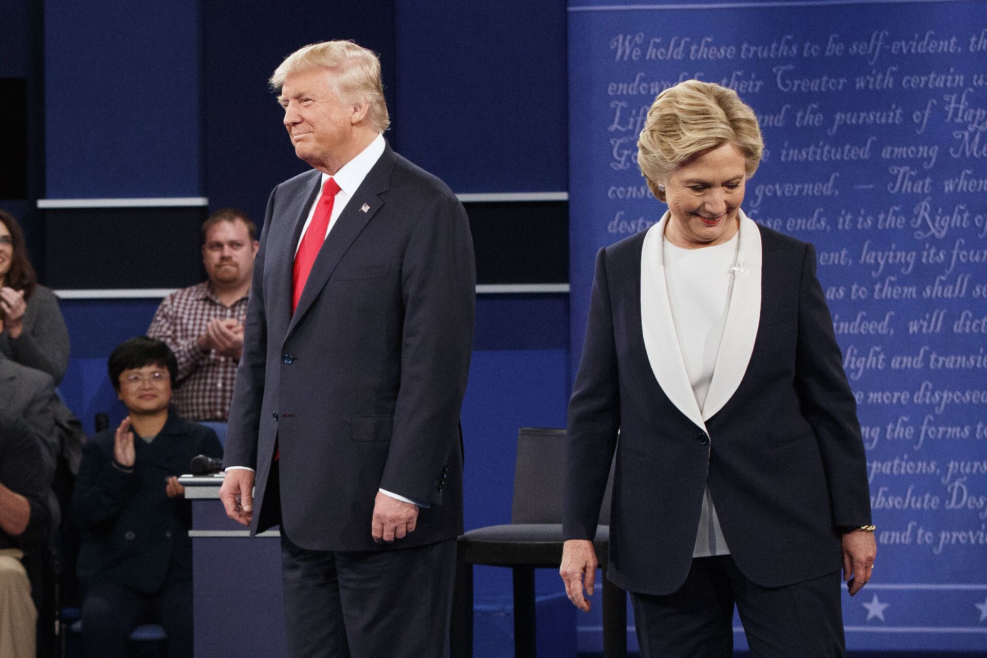 Republican presidential candidate Donald Trump, left, and Democratic presidential candidate Hillary Clinton walk to their seats after arriving for the second presidential debate at Washington University, Sunday, Oct. 9, 2016, in St. Louis - Sputnik International, 1920, 05.10.2021