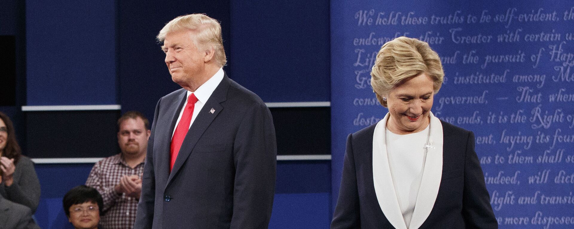 Republican presidential candidate Donald Trump, left, and Democratic presidential candidate Hillary Clinton walk to their seats after arriving for the second presidential debate at Washington University, Sunday, Oct. 9, 2016, in St. Louis - Sputnik International, 1920, 30.03.2022